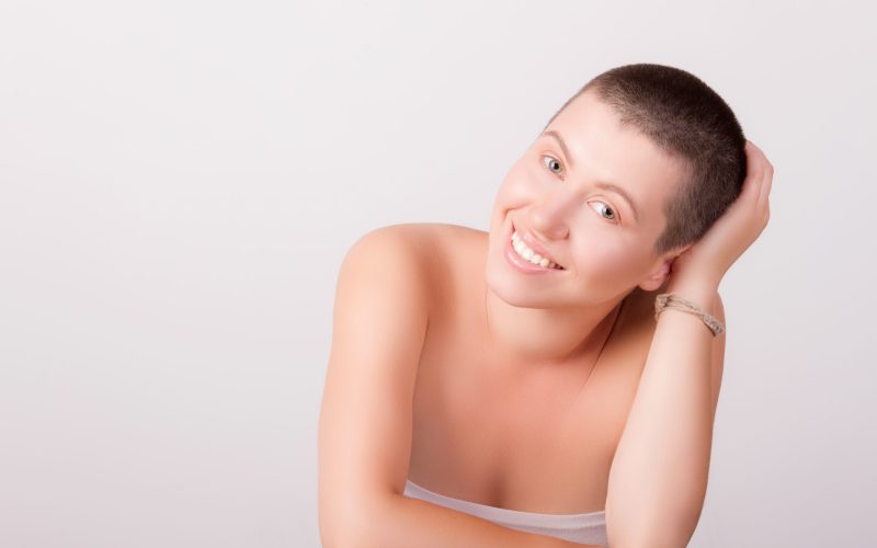 Close-up,Portrait,Of,Young,Bald,Girl,Smiling